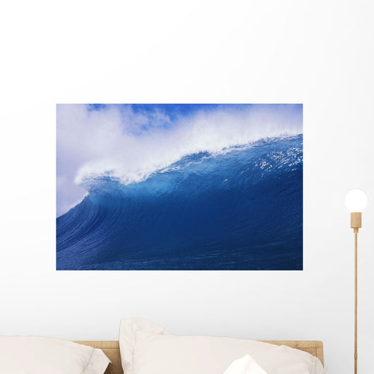 Blue Wave Curling Over Forming Barrel With White Waters Wall Mural