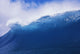 Blue Wave Curling Over Forming Barrel With White Waters Wall Mural