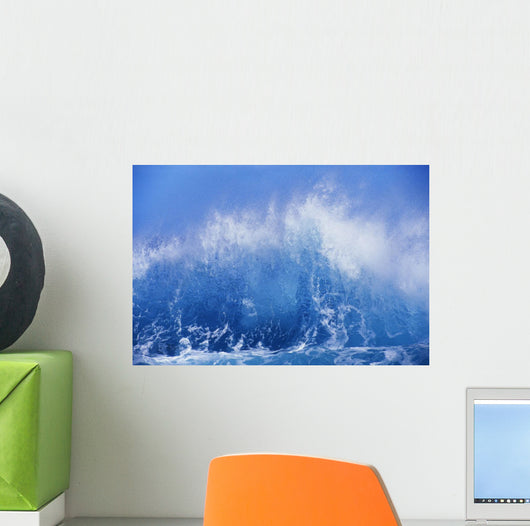 Blue Waves Crashing On The Shore With Blue Sky Background Wall Mural