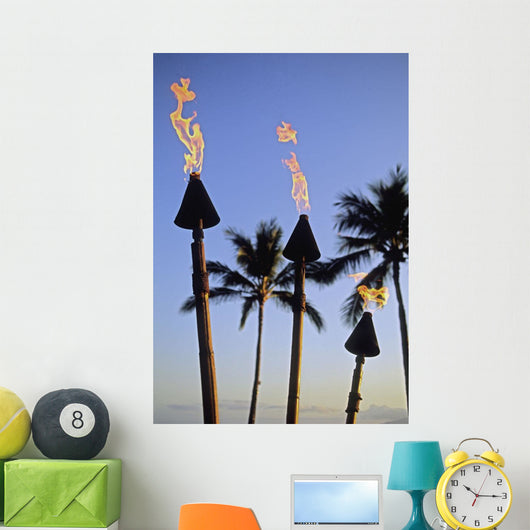 Hawaii, Tiki Torches Lit At Dusk, Palm Trees And Blue Sky Wall Mural