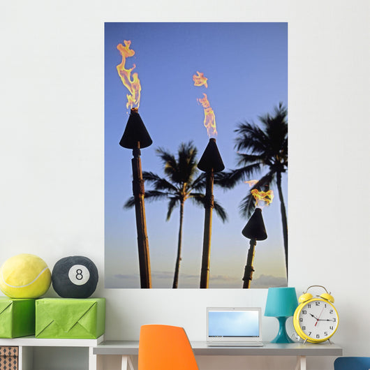 Hawaii, Tiki Torches Lit At Dusk, Palm Trees And Blue Sky Wall Mural