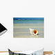 Tropical Seashell On The Beach With Gorgeous Clear Blue Ocean Behind Wall Mural