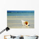 Tropical Seashell On The Beach With Gorgeous Clear Blue Ocean Behind Wall Mural