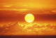View Of Huge Orange Sun Sinking Towards The Horizon Wall Mural