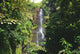 Hawaii, Maui, Hana Coast, Waterfall Surrounded By Lush Greenery Wall Mural