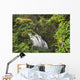 Waterfall Surrounded By Tropical Flowers And Plants Wall Mural