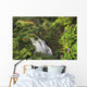Waterfall Surrounded By Tropical Flowers And Plants Wall Mural