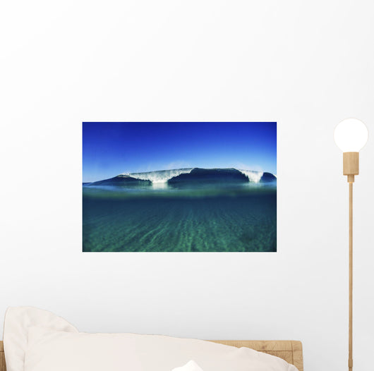 Wave Breaking In Distance, Glassy Turqouise Water In Foreground Wall Mural