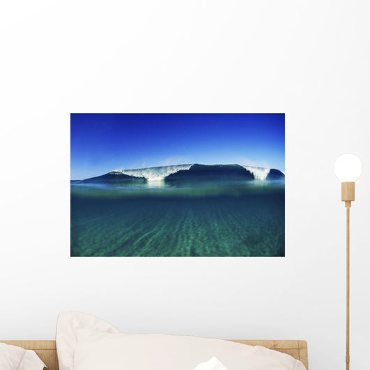 Wave Breaking In Distance, Glassy Turqouise Water In Foreground Wall Mural