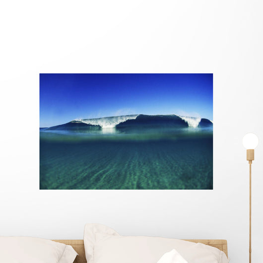Wave Breaking In Distance, Glassy Turqouise Water In Foreground Wall Mural