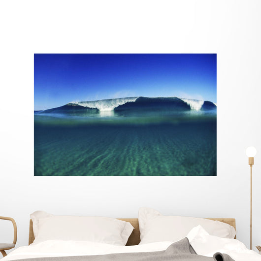 Wave Breaking In Distance, Glassy Turqouise Water In Foreground Wall Mural