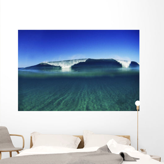 Wave Breaking In Distance, Glassy Turqouise Water In Foreground Wall Mural