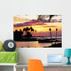 Orange Sunset With Palm Trees And Tiki Torches Wall Mural