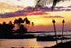 Orange Sunset With Palm Trees And Tiki Torches Wall Mural