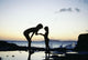 Mother And Daughter Silhouetted In Tidepool At Sunset Wall Mural