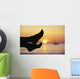Silhouette Of Feet In Front Of A Sunset Over The Ocean Wall Mural