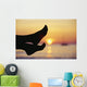 Silhouette Of Feet In Front Of A Sunset Over The Ocean Wall Mural