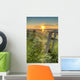 Sunset Over Water And A Fence Along The Shoreline Wall Mural