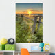 Sunset Over Water And A Fence Along The Shoreline Wall Mural