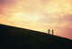 Hawaii, Couple Running Along A Hill At Sunset Wall Mural