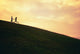 Hawaii, Couple Running Along A Hill At Sunset Wall Mural