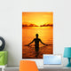 Silhouette Of Woman Wading In The Ocean At Sunrise Wall Mural