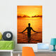 Silhouette Of Woman Wading In The Ocean At Sunrise Wall Mural
