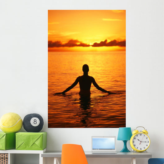 Silhouette Of Woman Wading In The Ocean At Sunrise Wall Mural