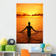 Silhouette Of Woman Wading In The Ocean At Sunrise Wall Mural