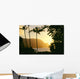 Yellow Sunset Through Palm Trees And Vegetation Wall Mural