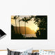 Yellow Sunset Through Palm Trees And Vegetation Wall Mural