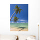 Palm Trees Lean And Cast Shadow On Beach Wall Mural