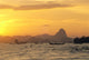 Pier And Mountains At Sunset Golden Orange Sky Wall Mural