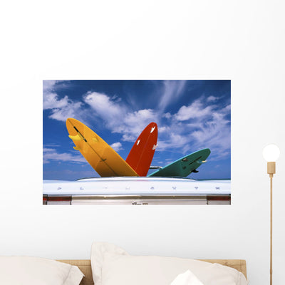 Colorful Surfboards Wall Mural shown on a wall