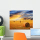 Golden sunset over farm field Wall Mural