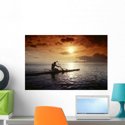 Native Man Kayaking Warm Wall Mural shown on a wall