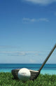 Golf Ball And Driver, Ocean In Blurred Background Wall Mural