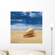 Close-Up Of Seashell On Beach With Ocean Soft Focus In Background A33D Wall Mural