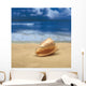 Close-Up Of Seashell On Beach With Ocean Soft Focus In Background A33D Wall Mural