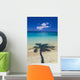 Shadow Of Palm Tree Onto Calm Beach Reef In Distance Wall Mural