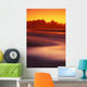 Beach At Sunset With Gentle Wave Rolling In Wall Mural