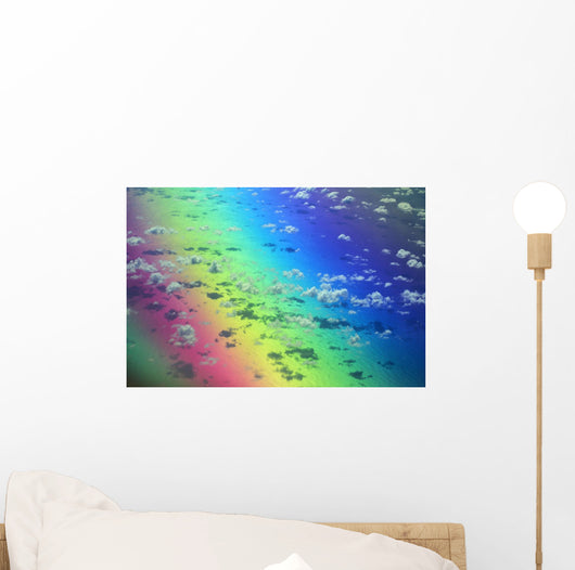 Polarized Rainbow And Aerial Of Clouds Over The Ocean Wall Mural