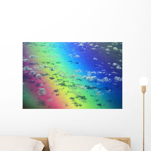 Polarized Rainbow And Aerial Of Clouds Over The Ocean Wall Mural