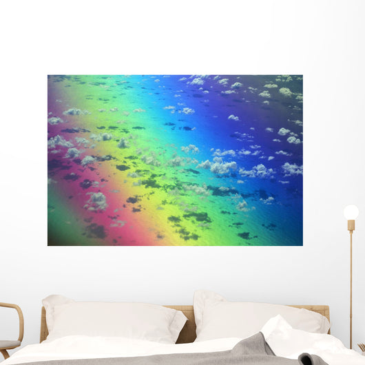 Polarized Rainbow And Aerial Of Clouds Over The Ocean Wall Mural