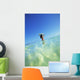 Over/Under View Of Woman Holding Surfboard On Head Wall Mural