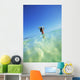 Over/Under View Of Woman Holding Surfboard On Head Wall Mural