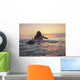 A Woman Laying On A Surfboard Watching The Sunset Wall Mural