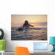 A Woman Laying On A Surfboard Watching The Sunset Wall Mural