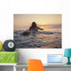 A Woman Laying On A Surfboard Watching The Sunset Wall Mural