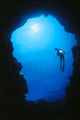Hawaii, Silhouetted Diver At Cavern Entrance With Flashlight, Sunburst Wall Mural